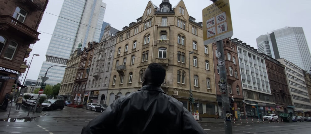 Jeffrey Peters walking through the city